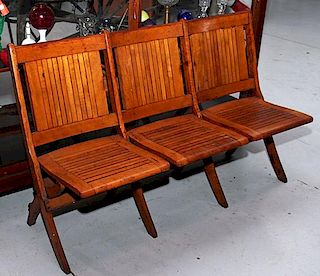 A group of three folding country store chairs
