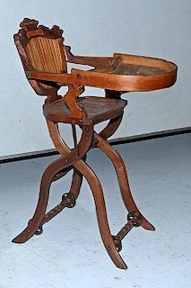 Victorian high chair, fine original condition with deep hewn walnut, break down example with iron wheels, 26" x 14" x 36"