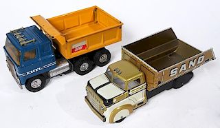 Two vintage dump trucks