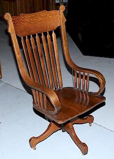 oak office chair,  circa 1890, 46" x 24" x 24", a high back chair with swivel base and bentwood arms, professionally restored