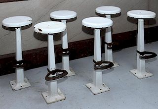 Six cast iron with porcelain seats and original foot rest Soda Fountain stools 36" h