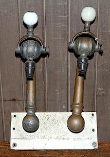 Set of late Victorian soda spouts, brass with glass knobs, spouts are 14" long