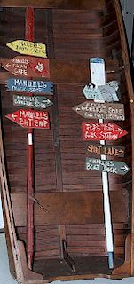 A pair of  Folk Art directioinal signs on boat paddles 90" and 70"