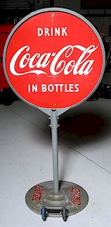 Coke sign a store front roll out with original base and two sided porcelain sign, roll out wheels have been replaced, restore