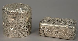 Two sterling silver repousse boxes including figural box and a Kirk & Sons floral round box. ht. 1 1/2in., lg. 3 1/2in. & ht.