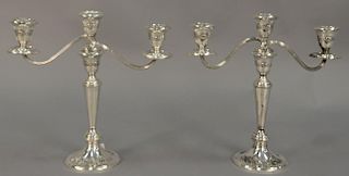 Pair of sterling silver weighted candelabra. ht. 11in., wd. 11 1/2in.