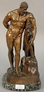 Bronze figure of Farnese Hercules leaning on a lion pelt and club in contraposto raised on rectangular base. total ht. 14in.