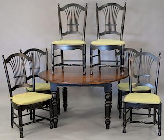 Eight piece dinette set including round table with one 23 1/2 inch leaf, six chairs, and sideboard. table: ht. 29in., top clo