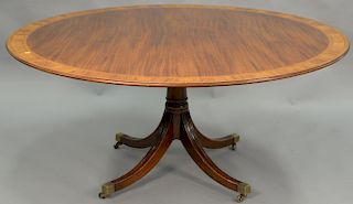 Banded inlaid mahogany pedestal table. ht. 29in., dia. 64in.
