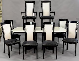 Ten piece contemporary dining set with eight chairs, table with two 15" leaves, sideboard and custom pads for table. ht. 30 1