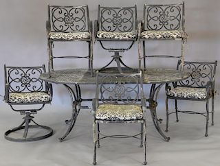 Seven piece metal outdoor set including table and six armchairs, two chairs swivel. table: ht. 29in., top: 43" x 73"