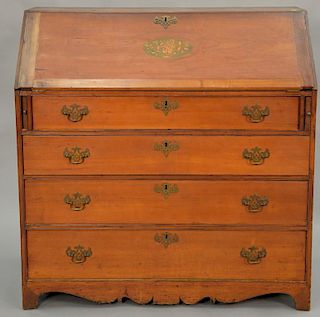 Federal cherry slant front desk with oval inlaid panel (feet reduced), circa 1800. ht. 44 1/4in., wd. 43 1/2in., dp. 18 3/4in