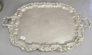 Three piece silverplate lot including large tray (lg. 32in.), large food cover with coat of arms, and footed wine cooler.