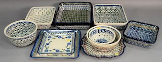 Ten handmade Polish pottery serving dishes including a tall square bowl signed Fryc, small square tray signed Chyka, large sq