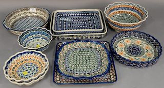 Ten handmade Polish pottery serving pieces including pie plate by Lenkiewicz, round casserole Anna Pasierbiewicz, four ruffle