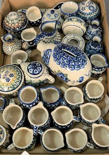 Tray lot of miniature handmade Polish pottery pieces including mugs, creamers, piggy bank, sugars, covered jars, etc. hand pa