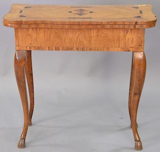 Oak inlaid games table with inlaid chess board inside, 19th century Continental. ht. 30in., wd. 32in.