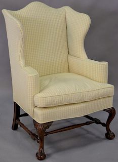 Custom Chippendale style mahogany ball and claw foot wing chair with clean custom upholstery.