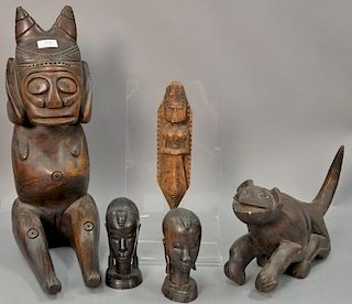 Large carved seated figure, pair of rosewood Tanganyika busts, African carved animal figure, and a carved figural Chinese arc