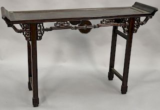 Chinese hardwood hall table with carved skirt (ht. 33in., lg. 53in.).