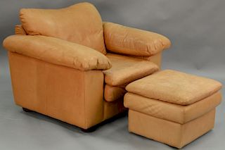 Leather easy chair and ottoman (sun faded). ht. 37in., wd. 49in.