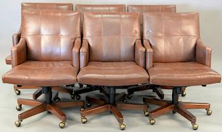 Set of six Councill leather swivel office armchairs.