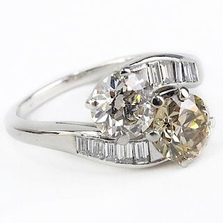 Art Deco Approx. Diamond and Platinum Bypass Ring set with an Approx. 1/32 Carat Round Brilliant Cut Fancy Brownish Yellow Di