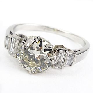 Art Deco Approx. 2.20 Carat Round Brilliant Cut Diamond and Platinum Engagement Ring accented with approx. .30 Carat Baguette