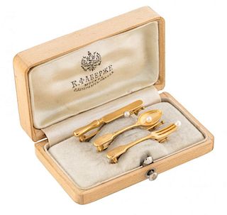A SET OF THREE GOLD AND SEED PEARL TROMPE l'OEIL BROOCHES IN SHAPE OF KNIFE, FORK AND SPOON, MARKED KF IN CYRILLIC FOR KARL F