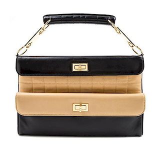 A Chanel Black and Tan Leather Handbag, 7" x 11" x 1".