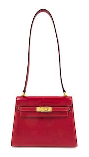 An Hermes 20cm Box Calf Rouge Kelly Handbag, 8" x 6" x 4".