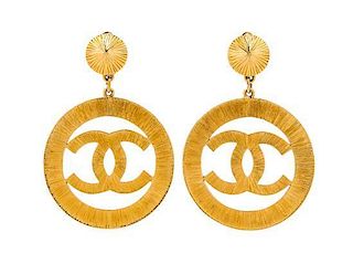 A Pair of Chanel Goldtone Logo Drop Earclips, 3.25" x 2.5".