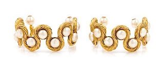 A Pair of Chanel Goldtone and Faux Pearl Cuffs, 7" circumference.