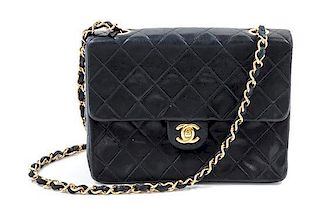 A Chanel Black Leather Quilted Handbag, 6" x 8" x 2.25".