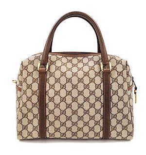 A Gucci Tan Monogram Canvas Handbag, 13" x 10" x 6".