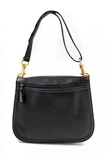 A Gucci Black Leather and Suede Reversible Saddle Handbag, 11" x 8" x 3".