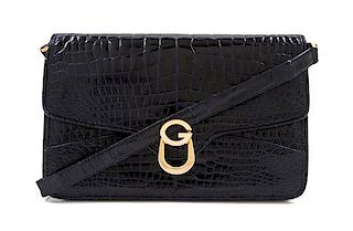 A Gucci Navy Embossed Leather Flap Handbag, 11" x 7" x 1.5".