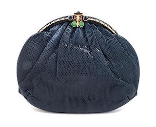 * A Judith Leiber Navy Leather Handbag, 9" x 7" x 1".