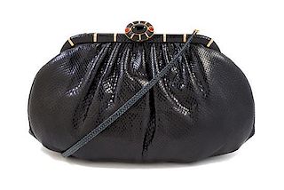 A Judith Leiber Black Leather Clutch, 11" x 6" x 3"; Strap drop: 21".