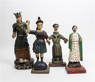 * A Group of Four Spanish Colonial Santos Figures Height of tallest 14 1/4 inches.