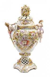 A Continental Porcelain Vase and Cover