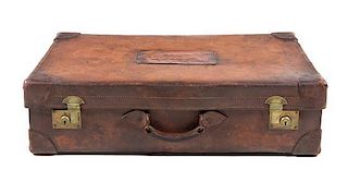 * A Leather-Clad Travel Case Height 8 x width 29 3/4 x depth 17 inches.