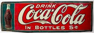 * A Vintage Metal Coca-Cola Advertising Sign 11 3/4 x 35 1/4 inches.