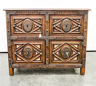 * A Baroque Style Carved and Polychromed Cabinet Height 33 x width 40 1/2 x depth 20 3/4 inches.