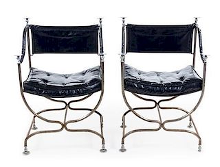 A Pair of Steel and Leather Campaign Style Armchairs Height 33 inches.