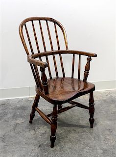 An English Oak Child's Windsor Armchair Height 28 1/4 inches.