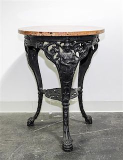 * A Victorian Wrought Iron Center Table Height 28 3/4 x diameter 22 inches.