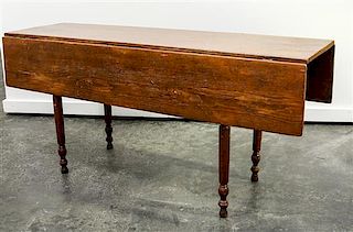 An American Drop Leaf Table Height 28 3/4 x length 64 x width 20 inches (closed).
