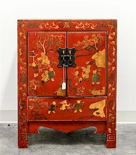 * A Small Chinese Red Lacquered Elmwood Cabinet