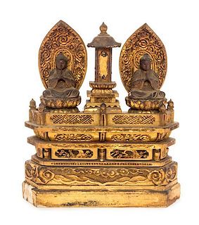 A Gilt Lacquered Wood Shrine with Two Buddha Figures Height 9 x width 8 x depth 2 1/4 inches.